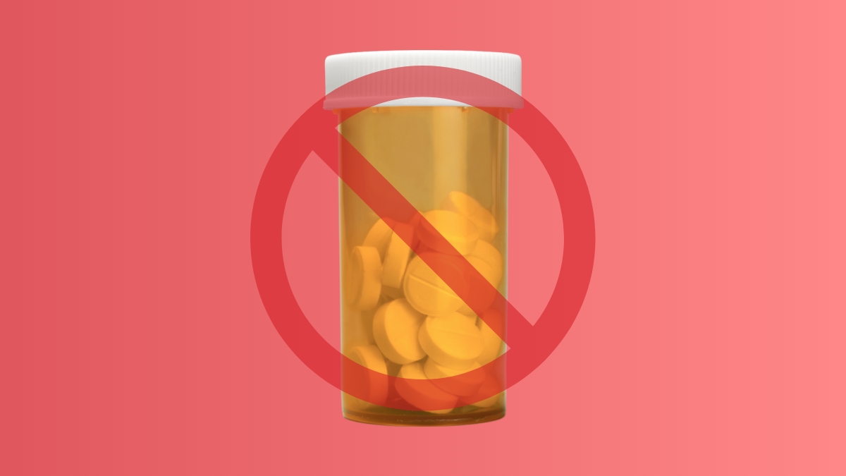 A bottle of pills with a cancel sign over